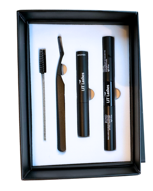 Set of eyebrow grooming tools including a brush, razor, and two black containers in a black box.