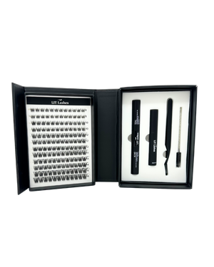 Eyelash extension kit with lashes and tools in a black case on a white background